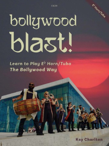 A book cover titled "bollywood blast!" with "Learn to Play Eb Horn/Tuba The Bollywood Way" and "Kay Charlton" at the bottom. The image features a group of musicians playing instruments, including a dhol drum and brass instruments, in front of a modern building with a red sky in the background. "C629" is in the top center, and "Eb Horn/Tuba" is diagonally in the top right corner.